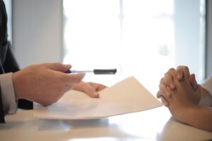 Commercial setting with business professionals and intellectual property documents